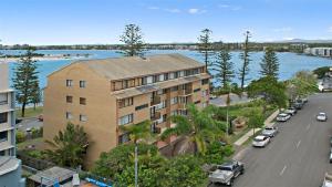 an apartment building on a street next to a road at Allamanda U2 Awesome Location in Caloundra