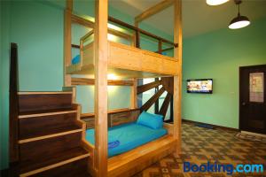 A bed or beds in a room at Lian Chinq Diving B&B