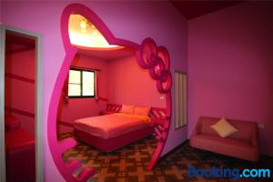 A bed or beds in a room at Lian Chinq Diving B&B
