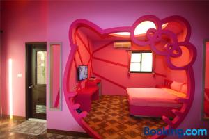 A bed or beds in a room at Lian Chinq Diving B&B