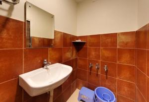 Phòng tắm tại Hotel Parag Deluxe Kolhapur +22 ảnh