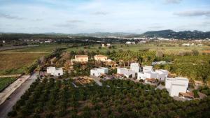 an aerial view of a white house in a field at Can Jaume by Ocean Drive in Ibiza Town