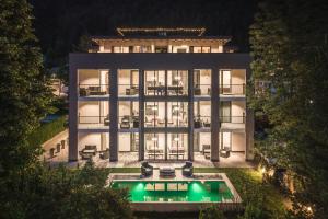 an aerial view of a building with a pool at XL Appartements Sand in Taufers in Campo Tures