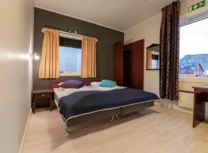 Postel nebo postele na pokoji v ubytování Melbu Hotell