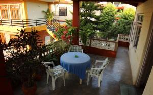 A balcony or terrace at New Tourist Guest House
