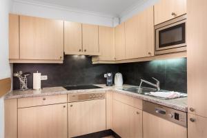 Kuchyň nebo kuchyňský kout v ubytování ALMHOF Alpin Apartments & Spa