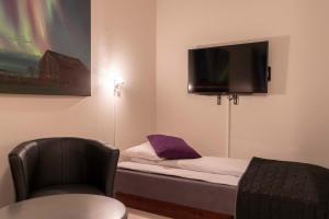Postel nebo postele na pokoji v ubytování Melbu Hotell