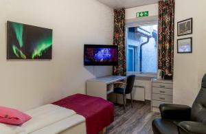 TV a/nebo společenská místnost v ubytování Melbu Hotell