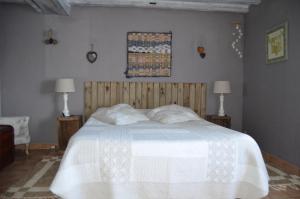 Säng eller sängar i ett rum på LA MAISON DU PECHEUR