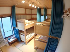 Poschodová posteľ alebo postele v izbe v ubytovaní Guesthouse SORA
