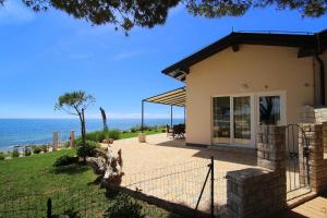 a house with a view of the ocean at Apartments Erica Luxury in Novigrad Istria