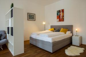 Tempat tidur dalam kamar di Albergo Diffuso ELA Living - Design Apartment & Room