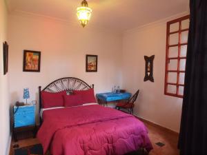 Postel nebo postele na pokoji v ubytování Riad Al khansaa
