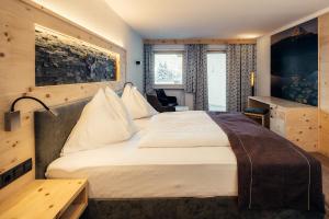 Postel nebo postele na pokoji v ubytování Hotel Post