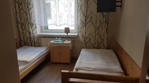 Posteľ alebo postele v izbe v ubytovaní Hotel Śnieżnik