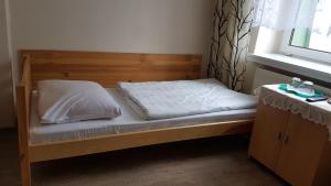 Posteľ alebo postele v izbe v ubytovaní Hotel Śnieżnik