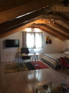 a bedroom with a bed and a desk in a room at Studio Gio in Zakynthos City in Zakynthos