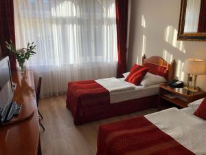 Postel nebo postele na pokoji v ubytování Hotel Ariston Prague
