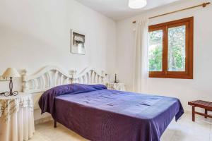 Posteľ alebo postele v izbe v ubytovaní Villa Punta des Port Quince