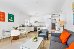 a living room with a couch and a table at Villa Valeria in Nerja