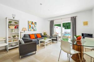 a living room with a couch and a table at Villa Valeria in Nerja