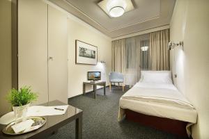 Posteľ alebo postele v izbe v ubytovaní Retro Hotel Kladno