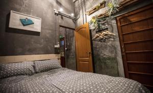 Voodi või voodid majutusasutuse Shen Nong Village toas
