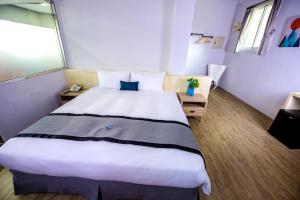 Giường trong phòng chung tại Youngs Hotspring Hotel