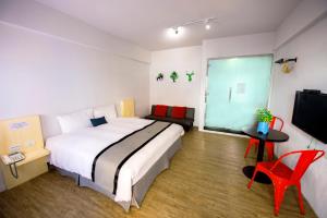 Giường trong phòng chung tại Youngs Hotspring Hotel