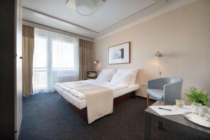 Posteľ alebo postele v izbe v ubytovaní Retro Hotel Kladno