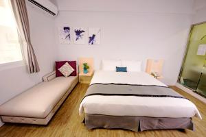 Giường trong phòng chung tại Youngs Hotspring Hotel