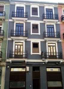 a large building with balconies on the side of it at NWT Central Station Apartments in Valencia