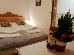 a bedroom with a bed with a christmas tree on it at Polakówka in Poronin