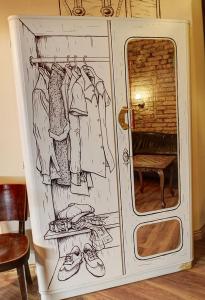 een tekening van een kledingkast met kleren bij Lavender Circus Hand Drawn Apartments in Boedapest