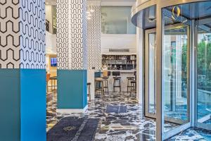 A kitchen or kitchenette at Airotel Stratos Vassilikos Hotel