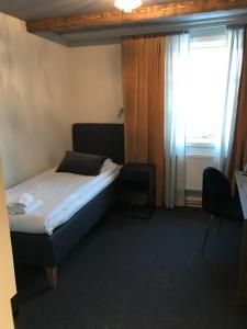 Postel nebo postele na pokoji v ubytování Hotell Gamla Staden