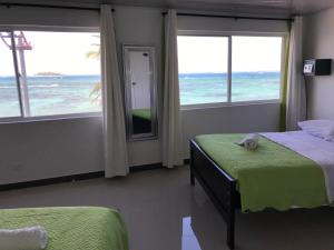 เตียงในห้องที่ Alojamiento View Jhony Cay