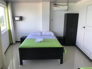 Postel nebo postele na pokoji v ubytování Alojamiento View Jhony Cay