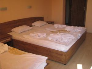 Postel nebo postele na pokoji v ubytování Vladimirov Guest House