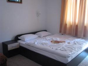 Postel nebo postele na pokoji v ubytování Vladimirov Guest House