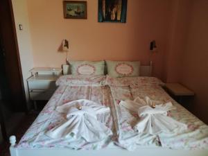 Ένα ή περισσότερα κρεβάτια σε δωμάτιο στο Ambrozia Spa and Relax family house