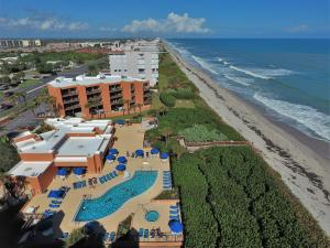 an aerial view of a resort and the beach at Oceanique Resort in Indian Harbour Beach