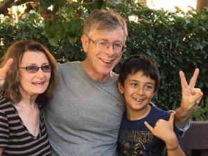a man and a woman and a child giving the peace signs at 4047 Wyandot Street in Denver +2 photos