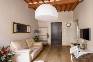 Televízia a/alebo spoločenská miestnosť v ubytovaní In Arezzo Apartment