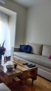 a living room with a couch and a coffee table at Apartamento en Palermo, Argentina in Buenos Aires