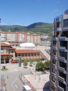 a view of a city with buildings and a street at Favila Oviedo in Oviedo