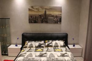 Postel nebo postele na pokoji v ubytování Manhattan House