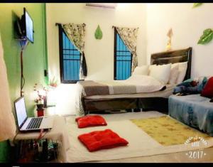 Tempat tidur dalam kamar di Pasak Holiday Six 2930