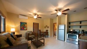 a living room with a couch and a kitchen at X'tan Ha- The Waterfront in San Pedro
