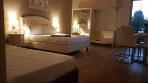 A bed or beds in a room at B&B Emozioni e Relax